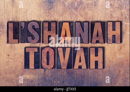 Die Worte L'Shanah Tovah Konzept und das Thema in Vintage Holz Buchdruck Typ auf Grunge Hintergrund geschrieben. Stockfoto