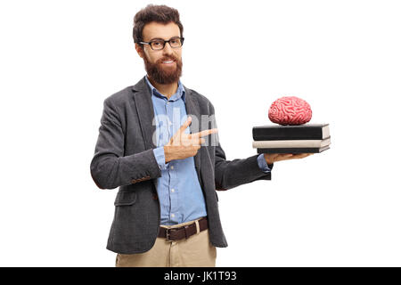 Lehrer zeigt auf eine Gehirn-Modell auf Bücher, die isoliert auf weißem Hintergrund Stockfoto