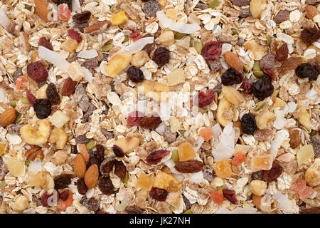 Müsli-Hintergrund - gemischten Früchten und Nüssen mit Getreideflocken und Samen als eine abstrakte Textur Stockfoto