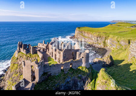 Ruins of medieval Dunluce Castle, cliffs, bays and peninsulas. Northern coast of County Antrim, Northern Ireland, UK.  Aerial view. Stockfoto