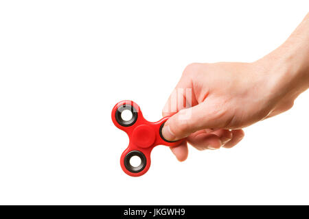 Männliche Hand, die rote Spinner isoliert auf weißem Hintergrund Stockfoto