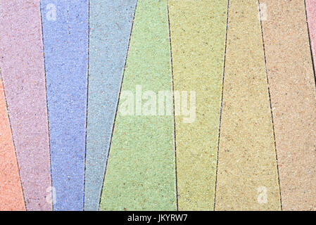 bunte abgespeckte Muster im Sand Hintergrund zeichnen Stockfoto