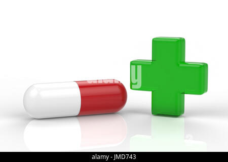 grünes Kreuz und Kapsel Pille auf weißem Hintergrund Stockfoto