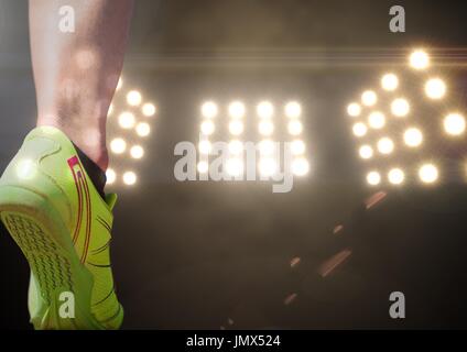 Digitalen Verbund aus Athlet Schuh vor Stadion Lichter Stockfoto