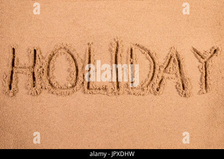 Geschrieben in weichen nassen Sand am Strand Urlaub Stockfoto