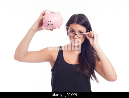 Junge Frau mit einem Sparschwein sorgen Stockfoto