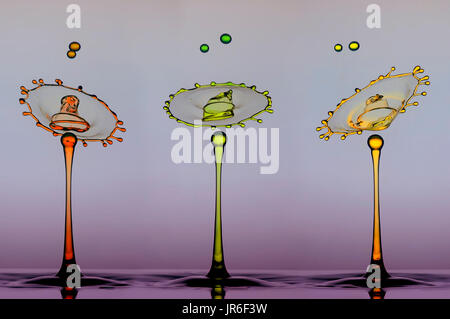 Mehrfarbige Wasser Tropfen und Spritzer Krone Stockfoto, Bild