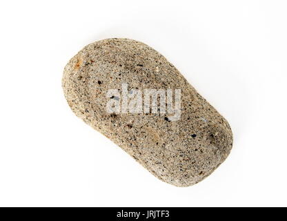 Stein aus dem Meer auf Weiß Stockfoto