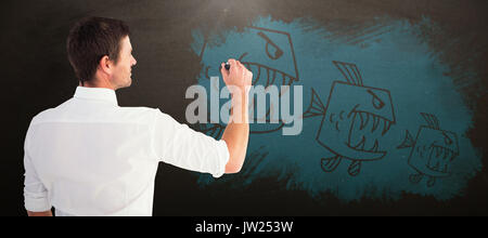 Business Mann schreiben mit Kreide gegen Blackboard Stockfoto