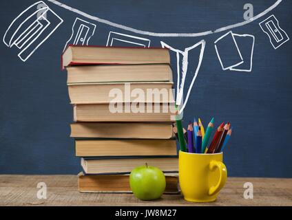 Digital composite der Bücher auf den Tisch gegen blaue Tafel mit Grafiken Stockfoto
