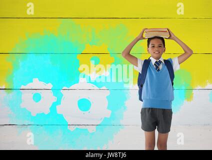 Digital composite der Schüler halten Bücher auf dem Kopf mit gemalten Hintergrund gelb und Einstellungen Zahnräder Zahnräder Stockfoto