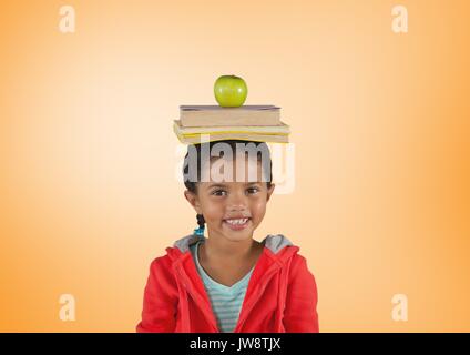 Digital composite von Mädchen mit Bücher und Apple auf Kopf vor orangen Hintergrund Stockfoto