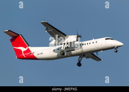 Qantaslink (Sunstate Airlines) de Havilland Canada DHC -8-315 q (Dash 8) VH-sbi auf Annäherung an der Melbourne International Airport zu landen. Stockfoto