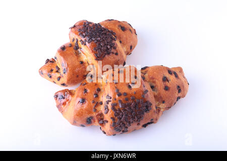 Knackig frische Croissant auf weißem Hintergrund, selektive konzentrieren. Stockfoto