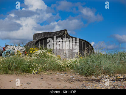 Hering Boot konvertiert Hütten auf die Heilige Insel von Lindisfarne aus der Northumberland Küste im Nordosten von England. Stockfoto