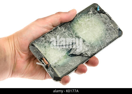 Mobiltelefon mit einem schlecht zerbrochen Bildschirm nach einem schweren Sturz. Stockfoto