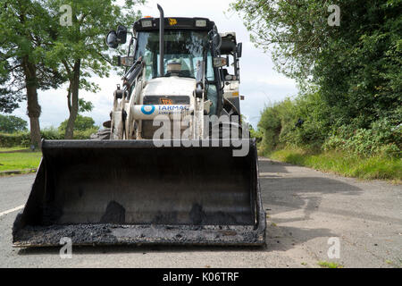 Straße Reparatur Bagger in einen Feldweg geparkt Stockfoto