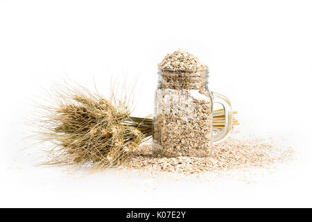 Korn Bouquet, goldenen Hafer Ährchen und kann mit getrockneten Körnern auf weißen Tisch gefüllt. Essen und jar, Bäckerei Konzept Hintergrund Stockfoto