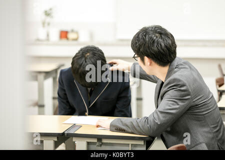 Lehrer Förderung einer Schule Junge Stockfoto