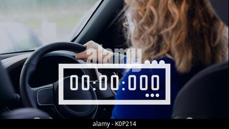 Digital composite von Symbol Uhr gegen Frau im Auto Stockfoto