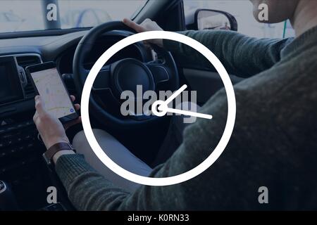 Digital composite von Symbol Uhr gegen Mann im Auto Stockfoto