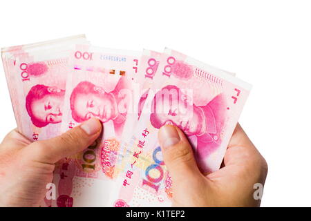 Weibliche Hände zählen Geld in Chinesische Yuan isoliert Stockfoto