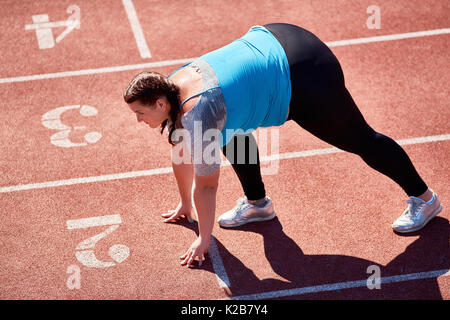 Frau auf Start Stockfoto