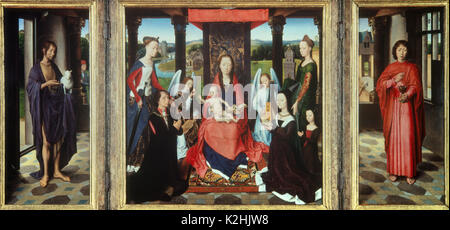 Triptychon von Hans Memling - Jungfrau Maria mit Kind und den Heiligen Stockfoto