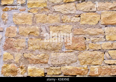 Kalkstein block Wand mit Zement closeup als Hintergrund Stockfoto