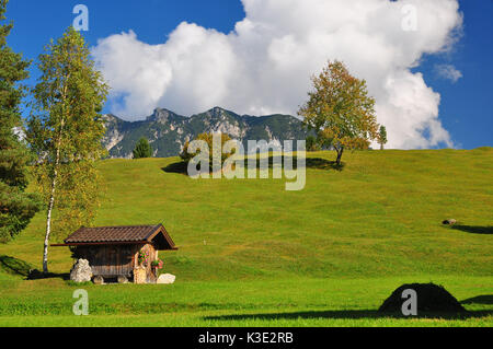 Deutschland, Bayern, Isartal, Buckelwiesen, Wolkenhimmel, Stockfoto