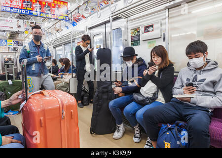 Japan, Hoshu, Tokio, Bahnreisende Stockfoto