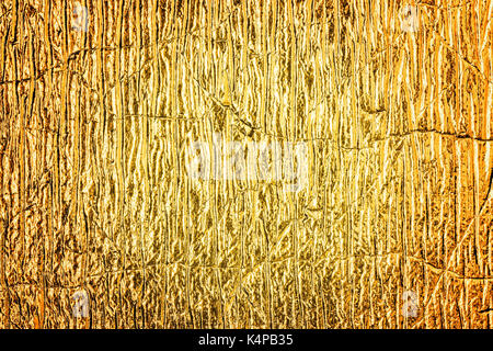 Nahaufnahme der goldene Folie abstrakte strukturierten Hintergrund. Stockfoto
