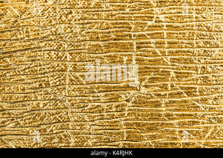 Nahaufnahme der goldene Folie abstrakte strukturierten Hintergrund. Stockfoto