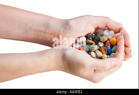 Viele verschiedene Edelsteine in Handvoll auf weißem Hintergrund Stockfoto