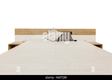 Bett aus Holz, isoliert auf weißem Stockfoto
