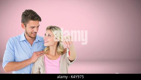 Digital composite von Paar Gedrückthalten der Taste vor Vignette Stockfoto