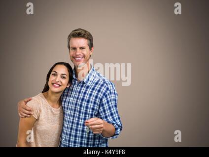 Digital composite von Paar Gedrückthalten der Taste vor Vignette Stockfoto