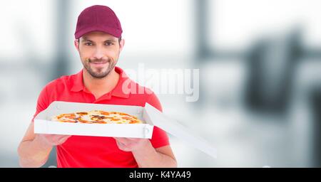 Digital composite der Lieferung Mann mit Pizza gegen blurry Büro Stockfoto