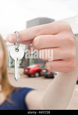 Digital composite von Frau mit Tasten mit Autos Stockfoto