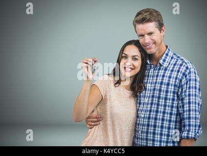 Digital composite von Paar Gedrückthalten der Taste vor Vignette Stockfoto