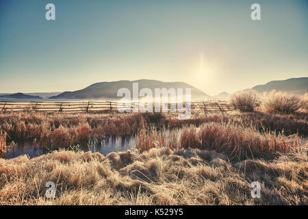 Retro getönten frostigen Sonnenaufgang an der Grand Teton National Park, Wyoming, USA. Stockfoto