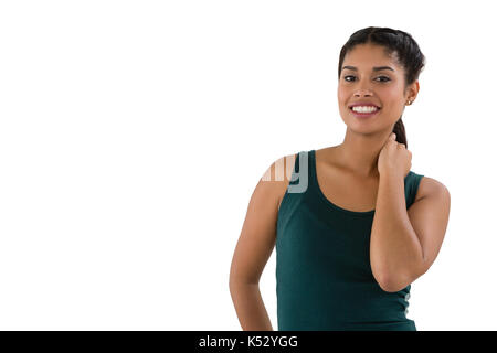 Portrait von lächelnden schönen Frau gegen den weißen Hintergrund Stockfoto
