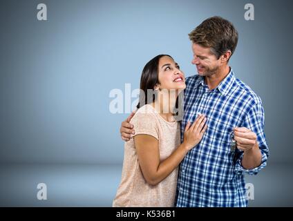 Digital composite von Paar Gedrückthalten der Taste vor Vignette Stockfoto