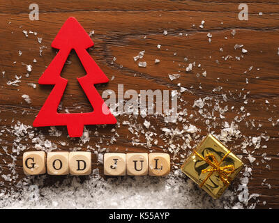 Skandinavische Weihnachten mit den Worten Gott Jul, Frohe Weihnachten Hintergrund Stockfoto