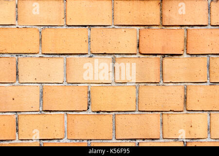 Wand von orange Backsteine closeup Stockfoto