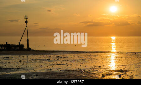 Schönen Sonnenuntergang am Strand in Hunstanton, Norfolk, Großbritannien Stockfoto