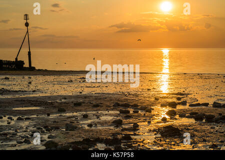 Schönen Sonnenuntergang am Strand in Hunstanton, Norfolk, Großbritannien Stockfoto