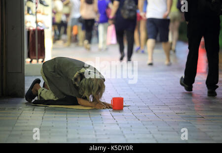 Bettler in Hong Kong Stockfoto