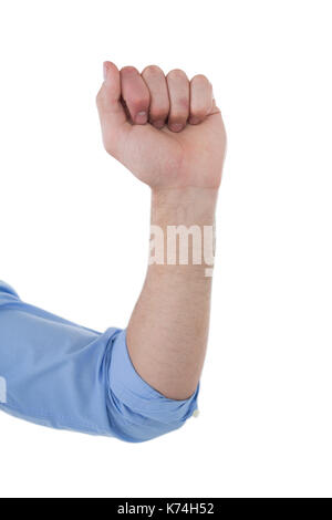 Zugeschnittenes Bild des Geschäftsmannes, die Faust gegen weißen Hintergrund Stockfoto