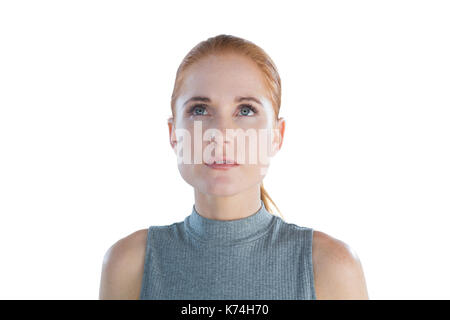 Der nachdenkliche junge Geschäftsfrau, die sich gegen die weißen Hintergrund Stockfoto